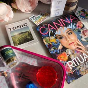 image of cannacurious magazine, the rolling kit, and product samples