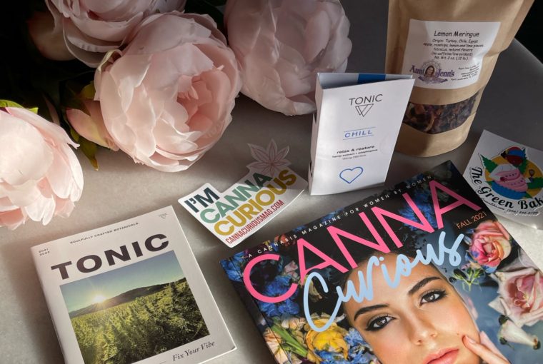image of cannacurious magazine, the rolling kit, and product samples