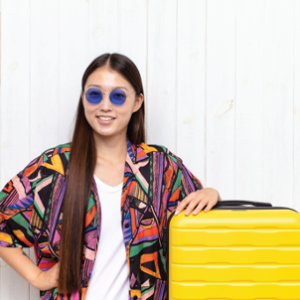 Image of woman with yellow suitcase