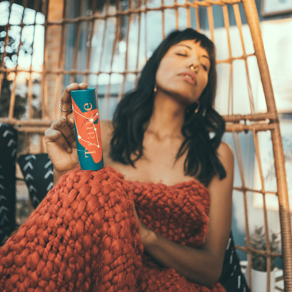 image of model holding tarot CBD oil